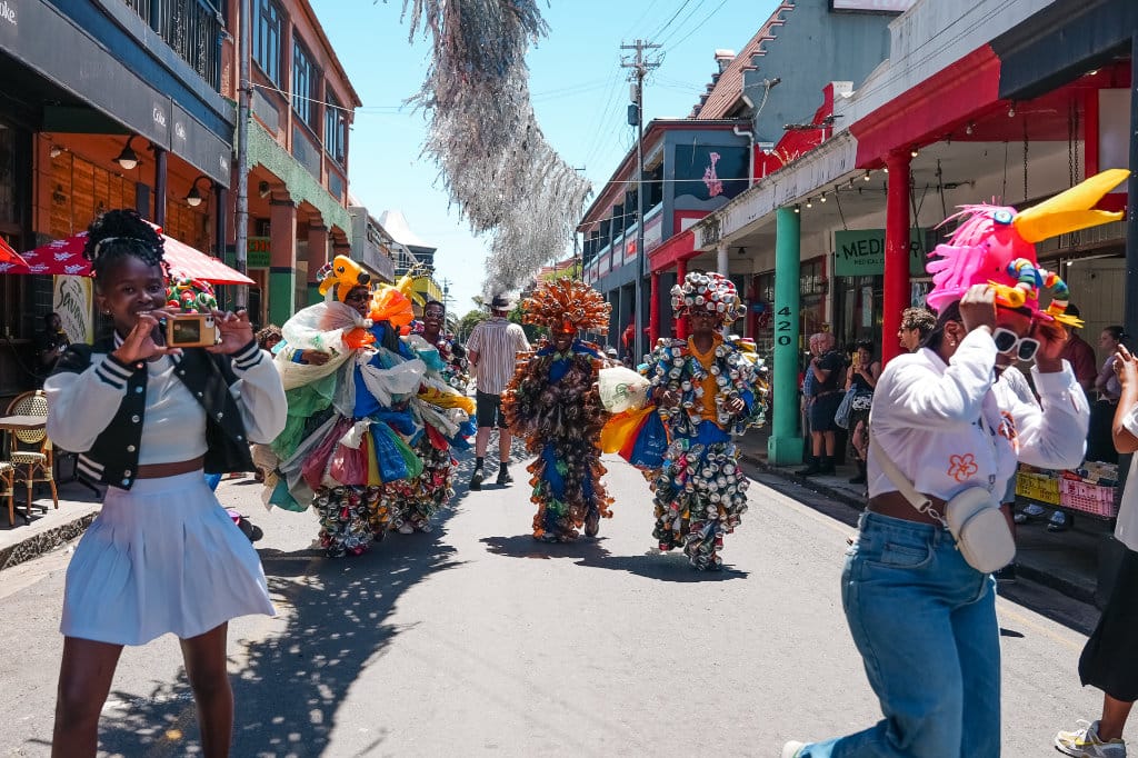 Streetopia performers dressed in recycled cans outfits in the streets of Observatory