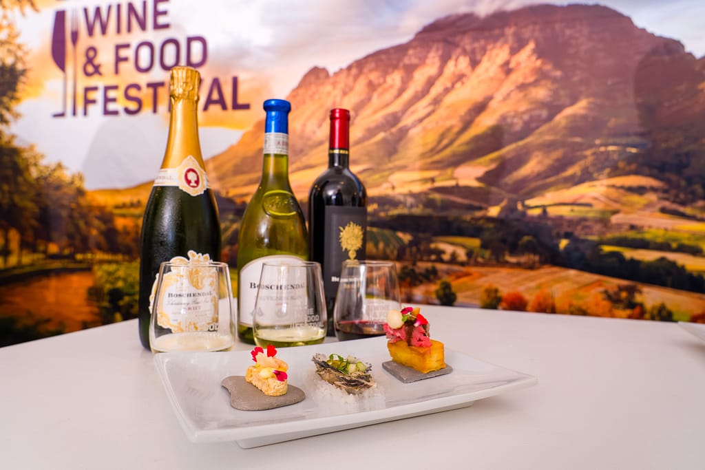 Three bottles of Boschendal wine tasters with 3 paired food items