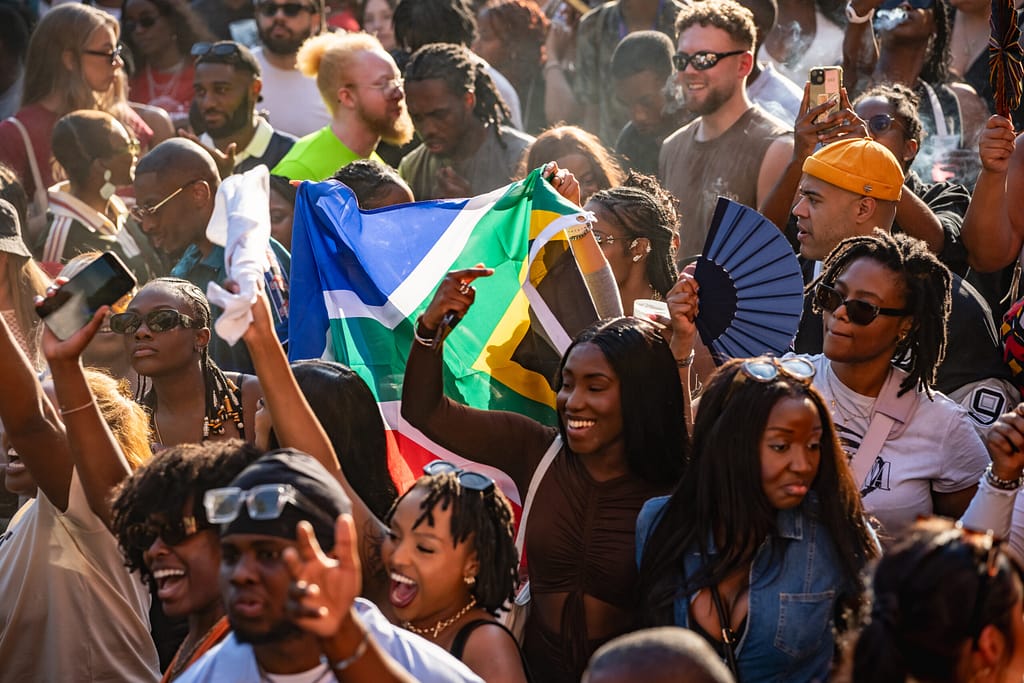 Piano People Cape Town crowd view with South African flag