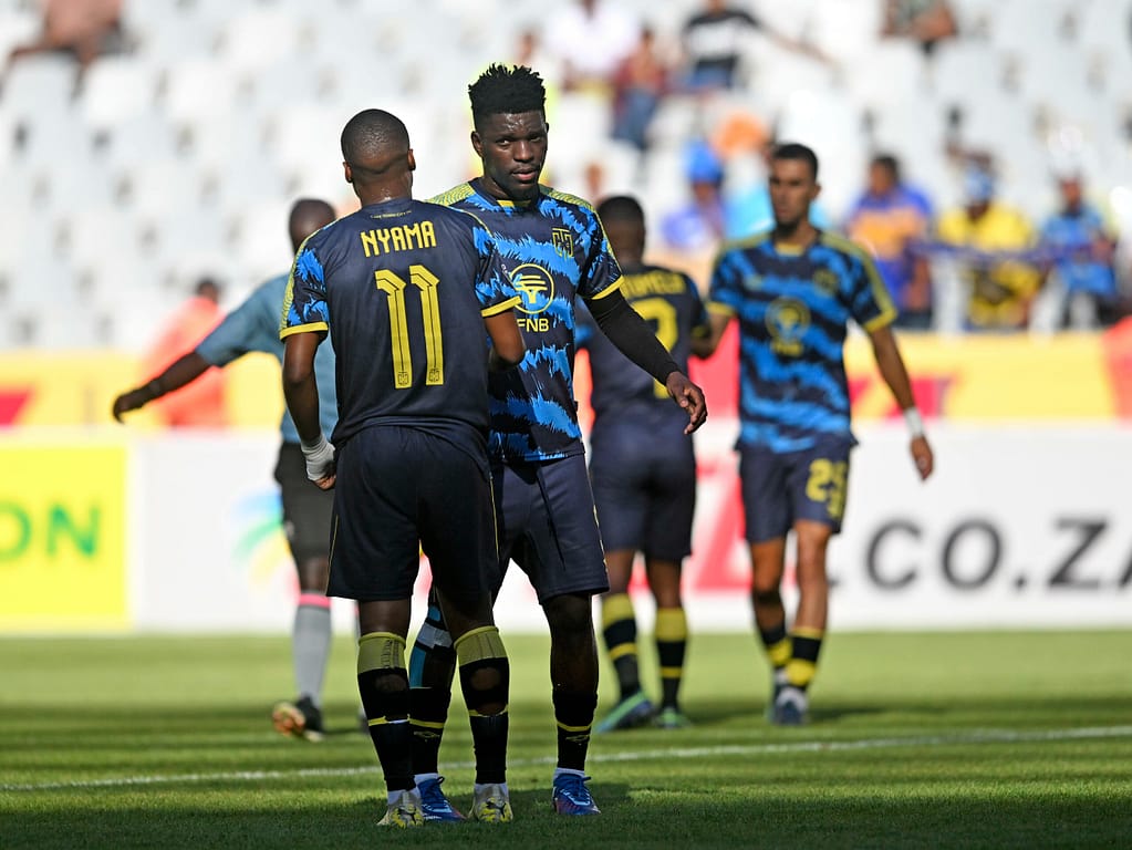 Tshegofatso Nyama and Fidel Brice Ambina of Cape Town City celebrate victory at the final whistle after the DStv Premiership 2023/24 football match between Cape Town Spurs and Cape Town City at Cape Town Stadium