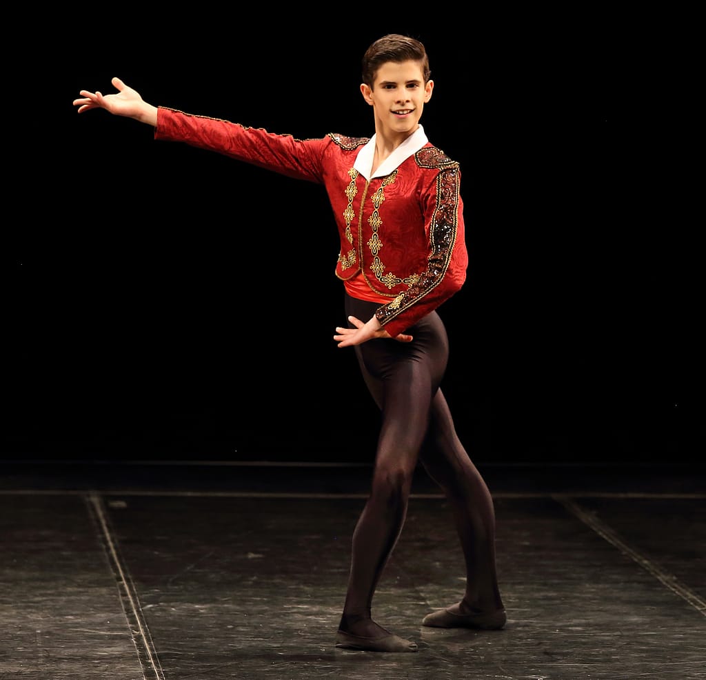 Boy ballerina in red waistcoat at SA International Ballet Competition