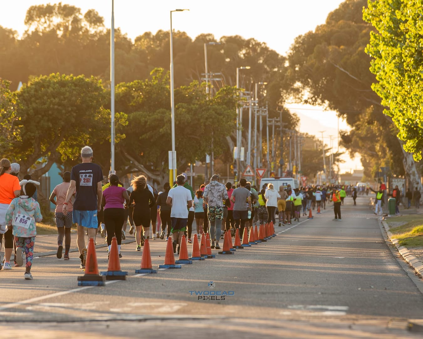 Run4Freedom participants running down Washington Street in Langa