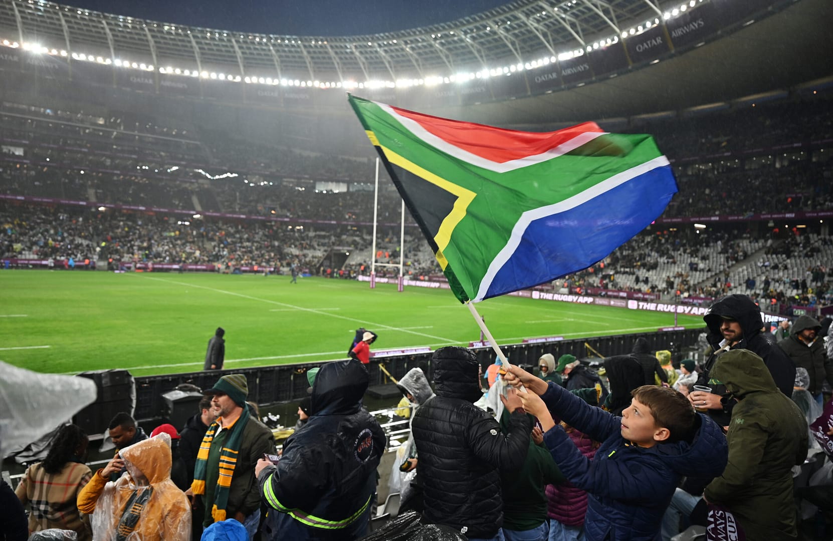 A Boks fan waves a South African flag during a match at DHL Stadium