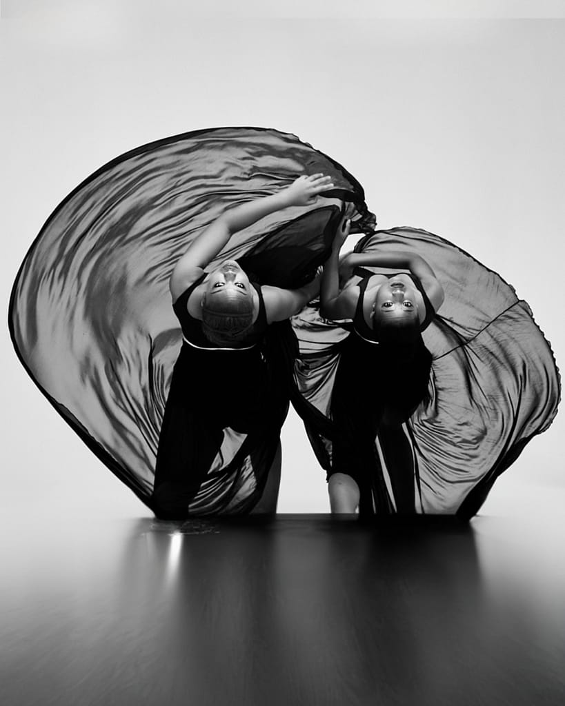 Black and white image of dancers in studio